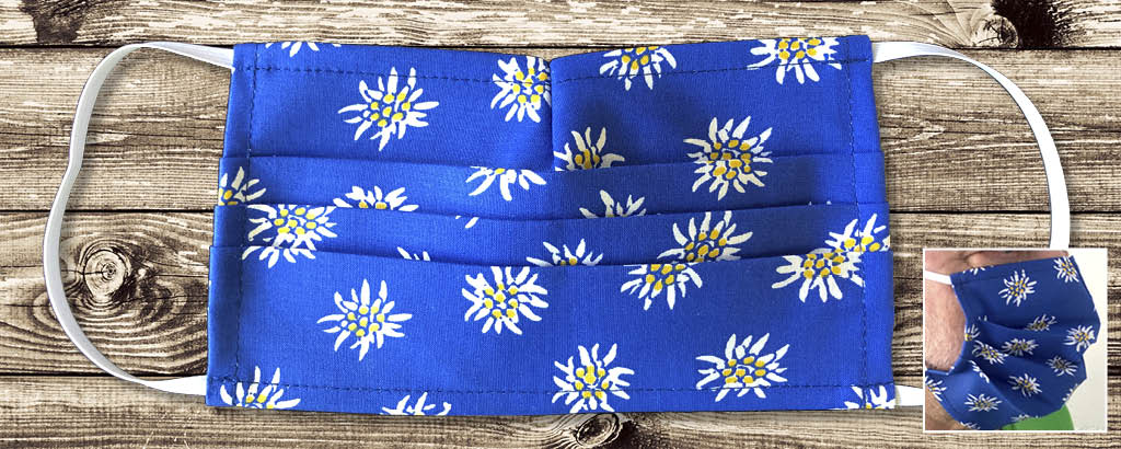 Designer Schutzmaske mit blauem Edelweiss Motiv